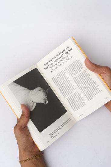 Person holding an open book 